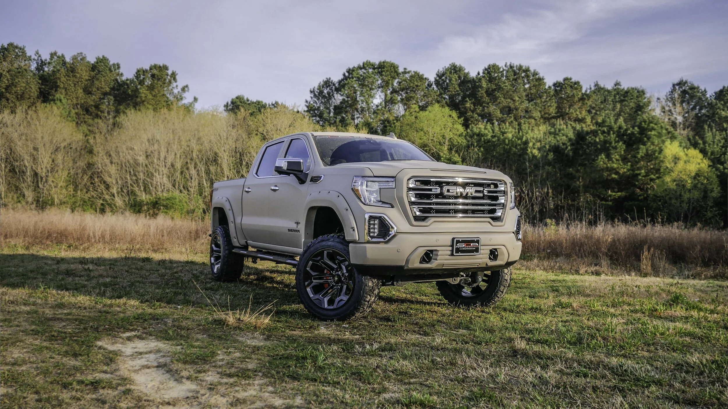 GMC BLACK WIDOW LIFTED TRUCKS — SCA Performance | Black Widow Lifted Trucks