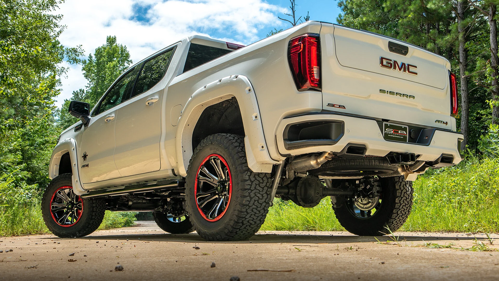 GMC BLACK WIDOW LIFTED TRUCKS — SCA Performance | Black Widow Lifted Trucks