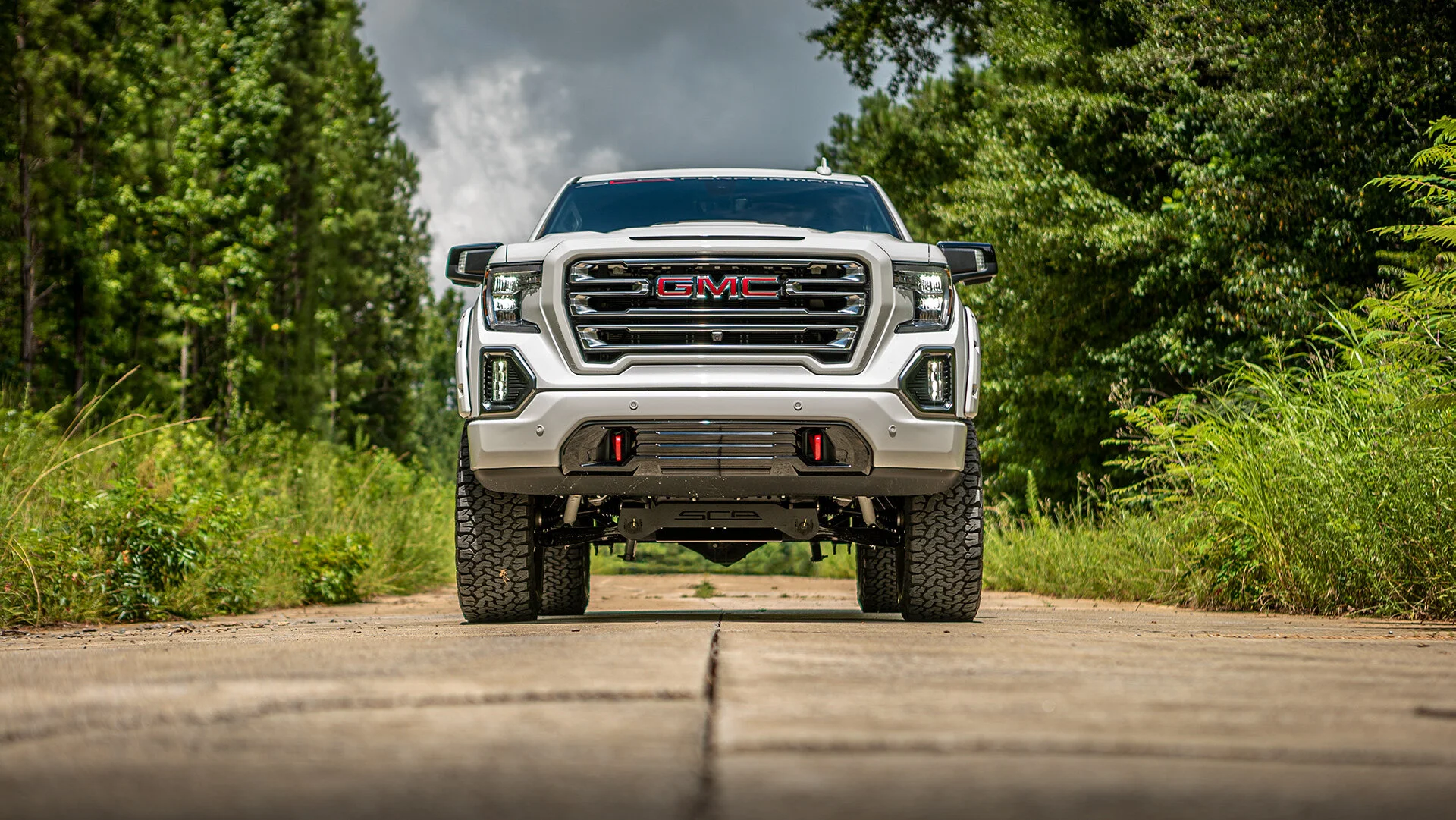 GMC BLACK WIDOW LIFTED TRUCKS — SCA Performance | Black Widow Lifted Trucks