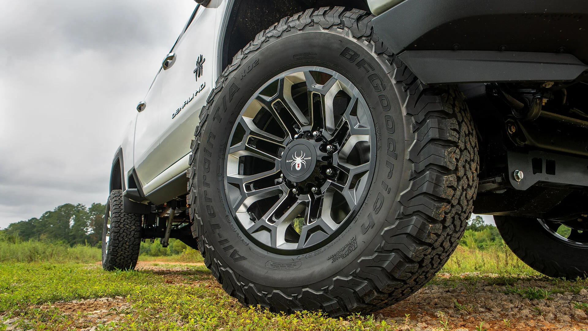 GMC BLACK WIDOW LIFTED TRUCKS — SCA Performance | Black Widow Lifted Trucks