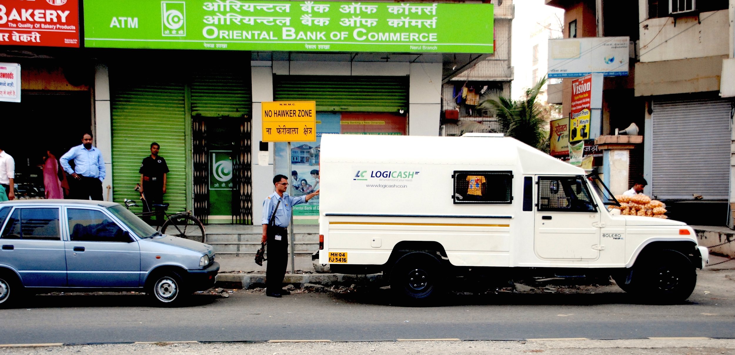 LogiCash employee refills ATM machine in India (photo: LogiCash
