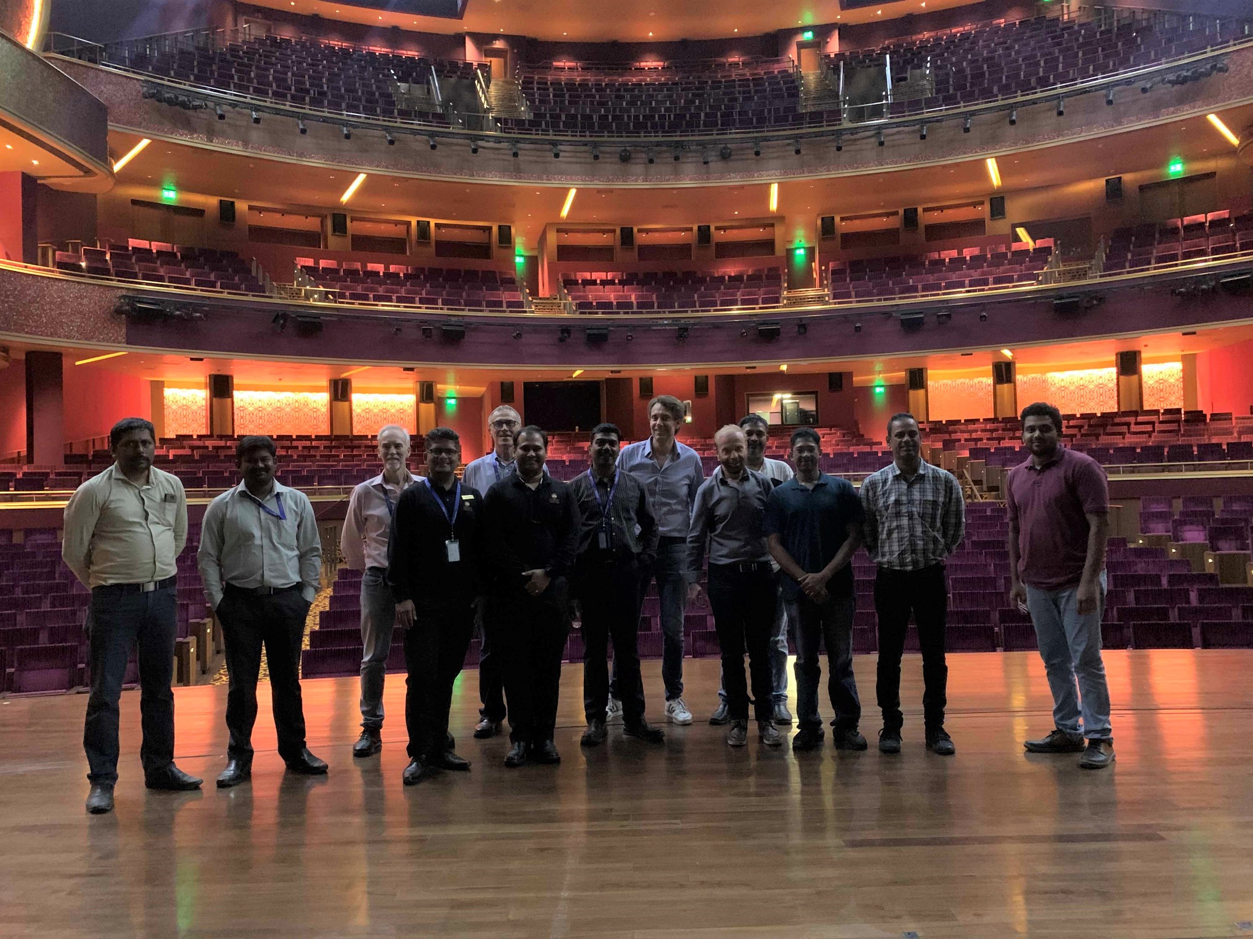 The SIAP and Reliance team together in the concert hall of the JIO World Centre