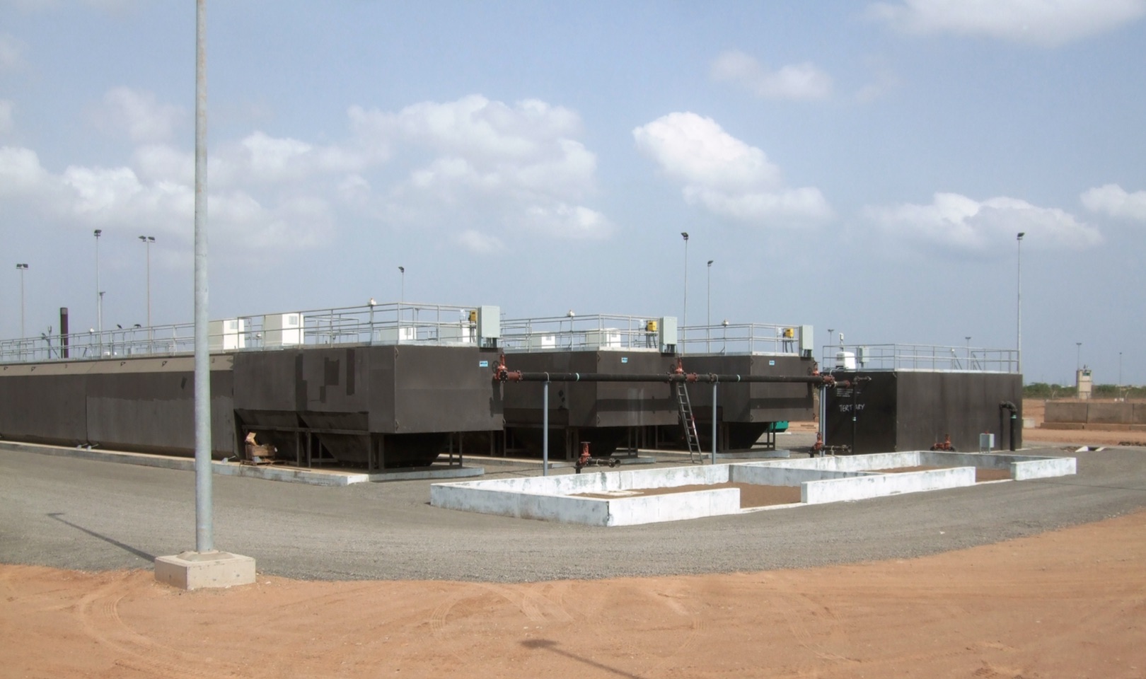 Camp Lemonier, Djibouti 3x 80,000 GPD (3.5 l/S) High Rate Prefabricated steel secondary treatment systems, 125,000 GPD (5.5 l/s) Dual Media Tertiary Filter, Bolted Steel potable water tanks with booster station pump skid 