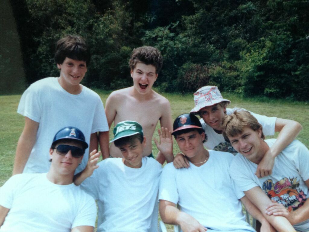 David Poritzky (1981-91) sent in this photo to the left from 1987: Back row — Judd Henry, Brett Moore , and Eric Diamond (with his signature hat); Front row-- Jimmy Moscou, JJ Shapiro, Brandt Josephson , and Randy Au . As demonstrated by Jimmy and Brandt, it was the era of the non-safety baseball helmet. 
