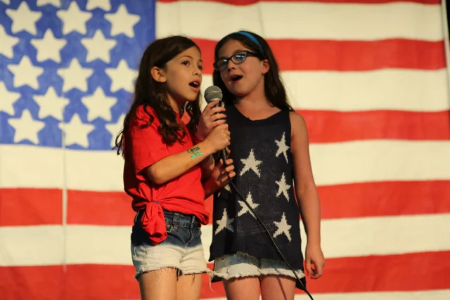 Two Jinters sing "Tomorrow" (from Annie) during the 4th of July Talent show.