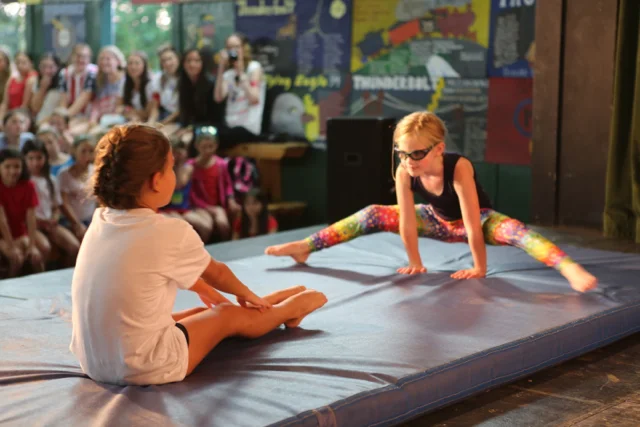 A Jinter and Inter perform gymnastics.