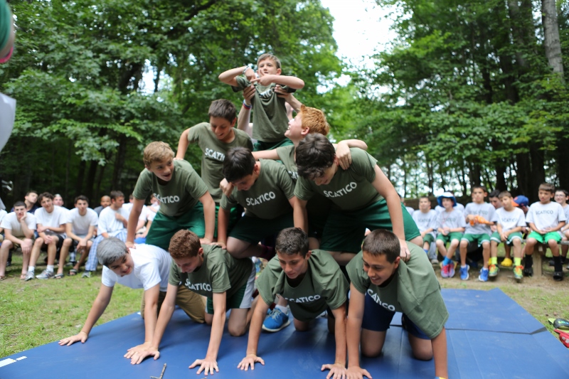  Timed human pyramids at the College Bowl campfire. 