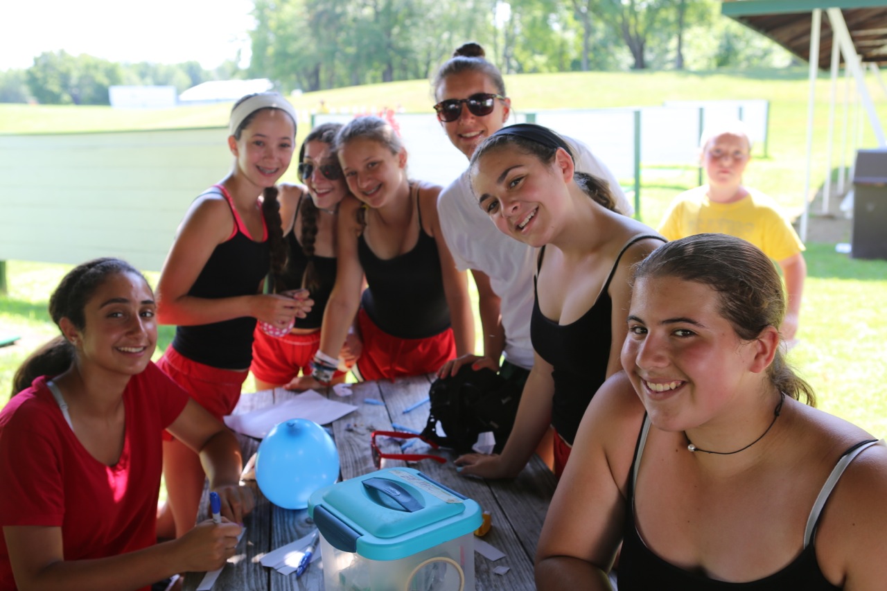 The Sub girls run zap mail (campers deliver messages to each other in balloons.)