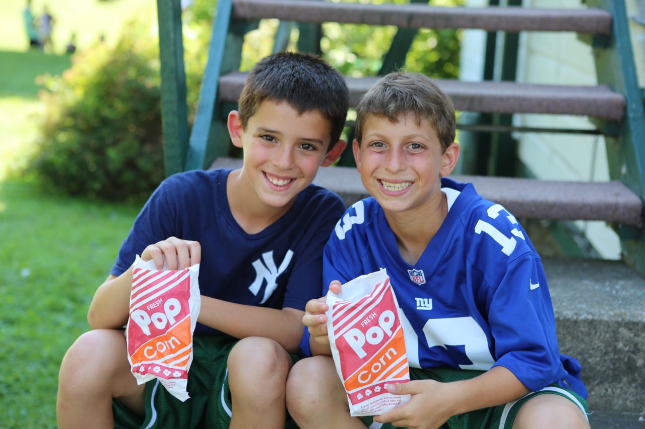 Sub Junior boys enjoy popcorn.