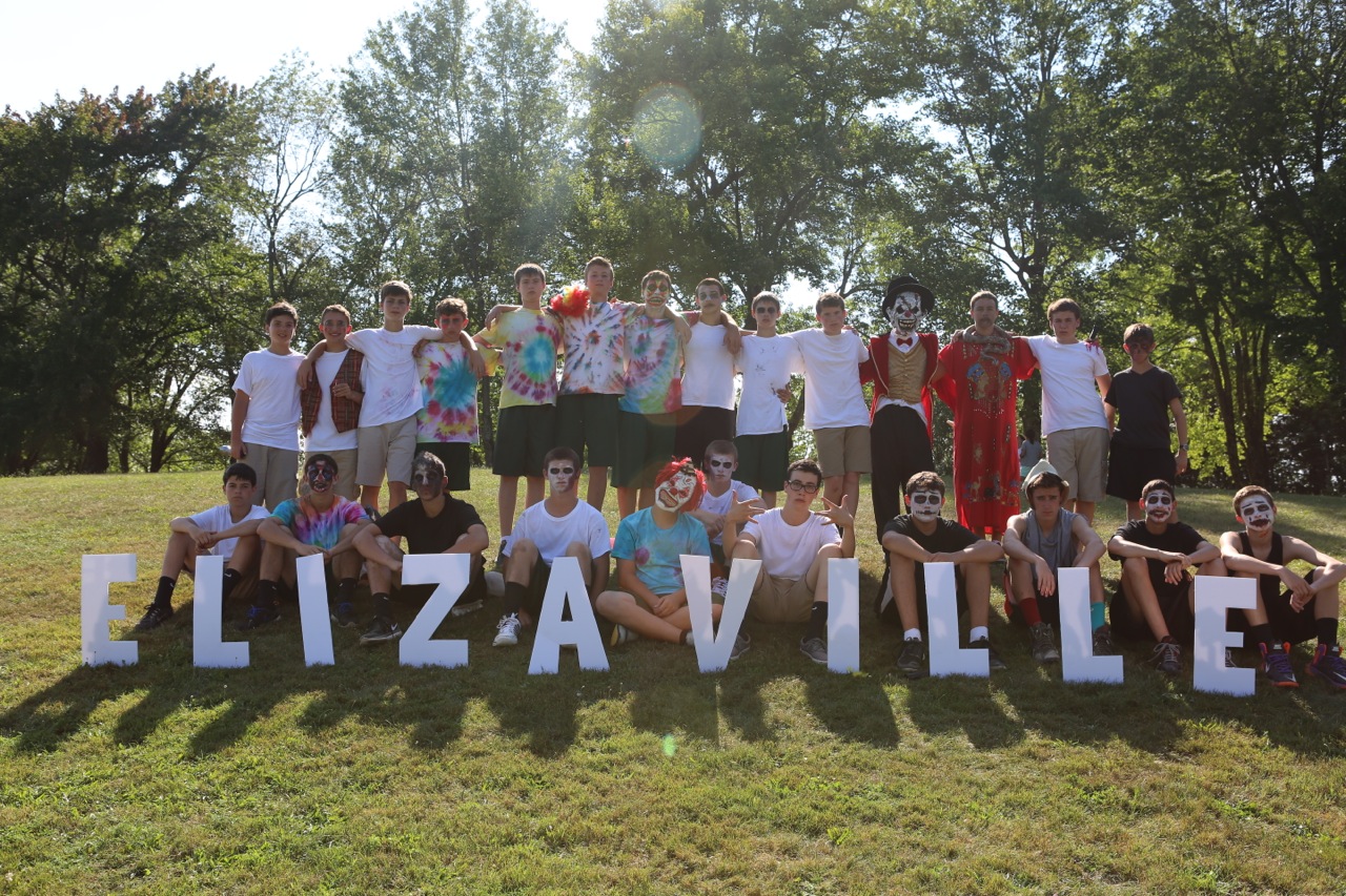 Upper Seniors pose with our Elizaville sign.