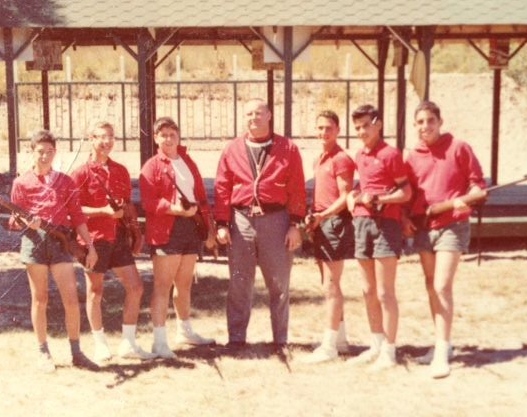 From Steve Florin —1960s Riflery Team from the 1950s: Paul Goodman, Scooter Schneider, Dennis Plehn, Coach Bill Powley, Steve, Drew Drazen and Frank Gunsberg (love the red jackets).,