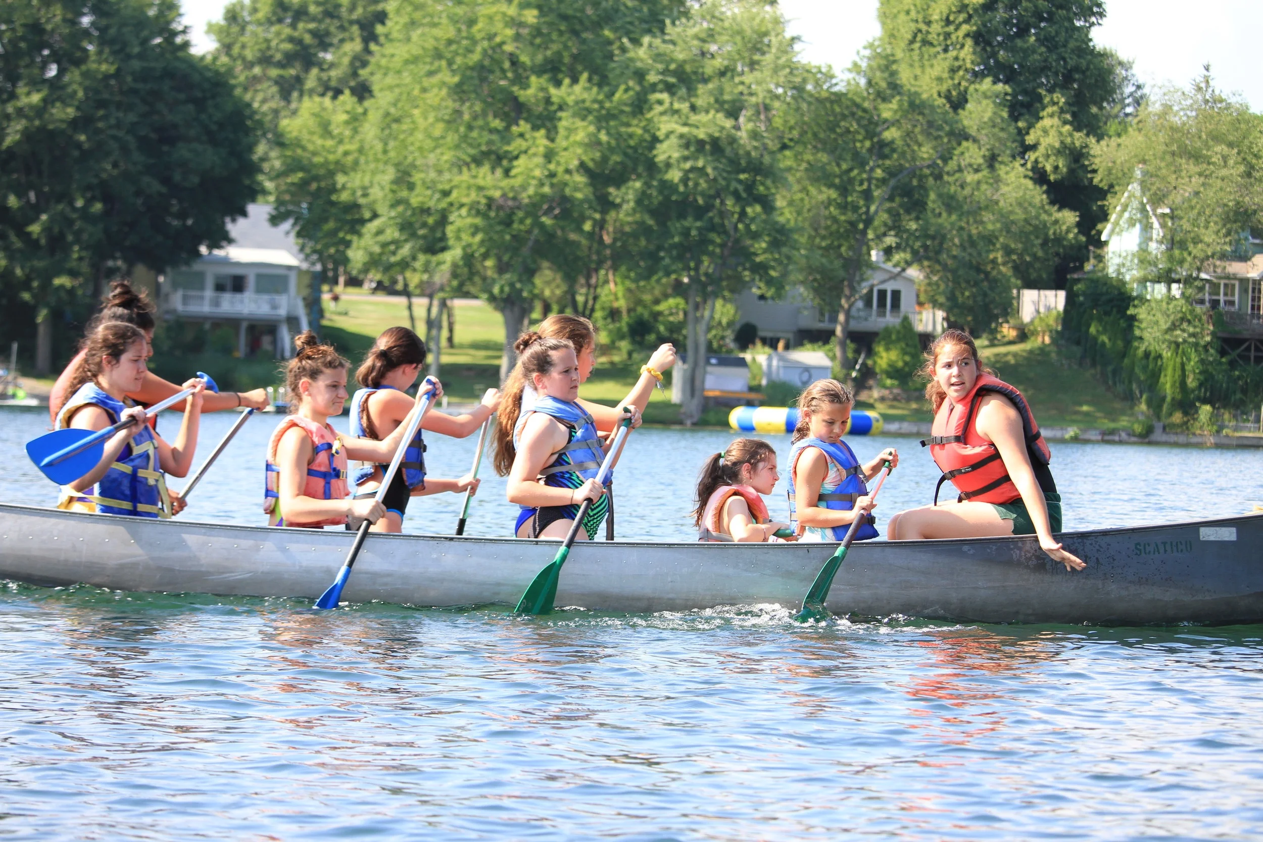 Sooper Anna Rosenfeld leads a all-division War Canoe during the Tribes' Swim Meet 