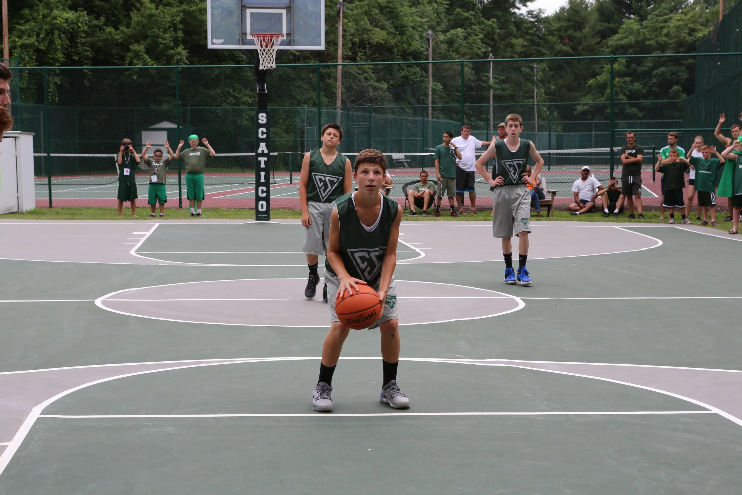 Above: Henry Beck on the foul line Right: Jared Simons goes up for a shot