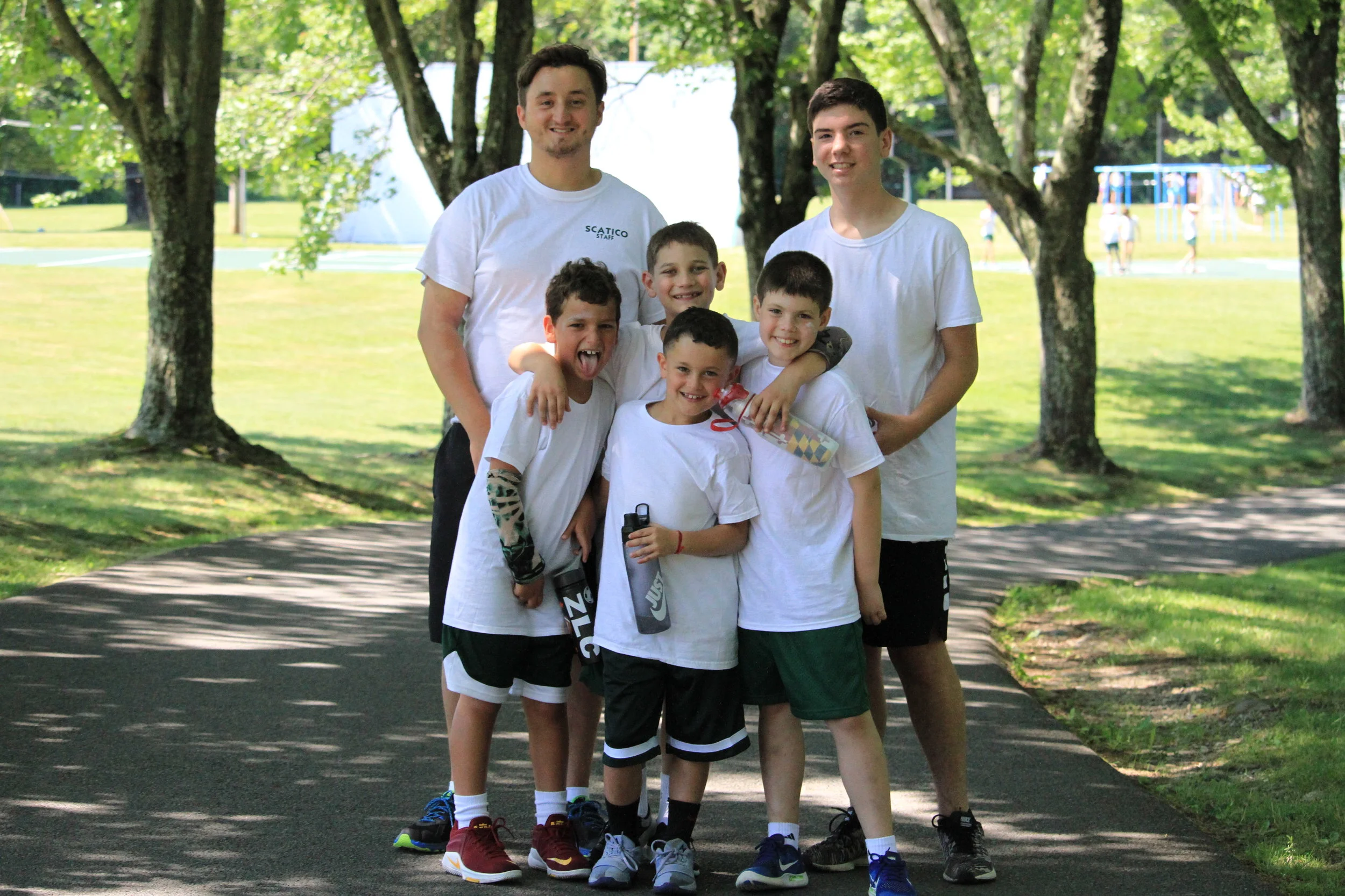 Sophomore boys stop and pose on the road path! 