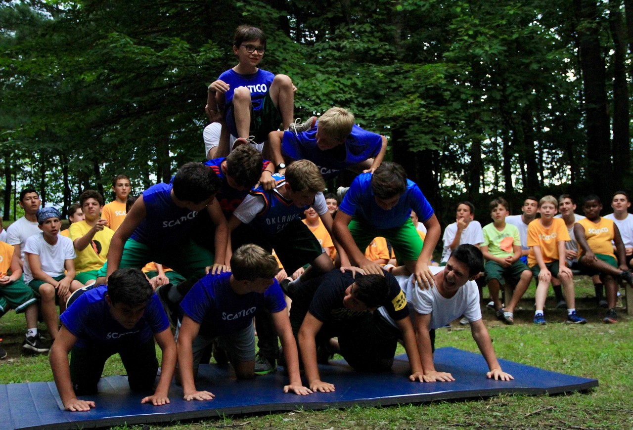Campers put their strength to the test in a human pyramid