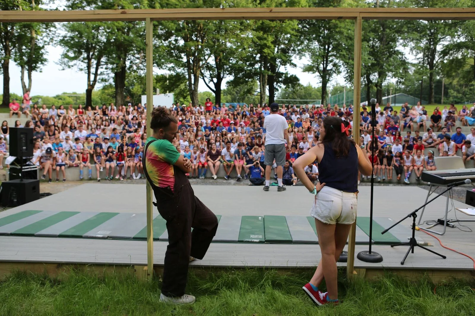 July 4, 2016 —Opening Night at the Amphitheater. Jake Lisabeth and Jane Rosenfeld (both 2004-16) are ready to host the Talent Show.
