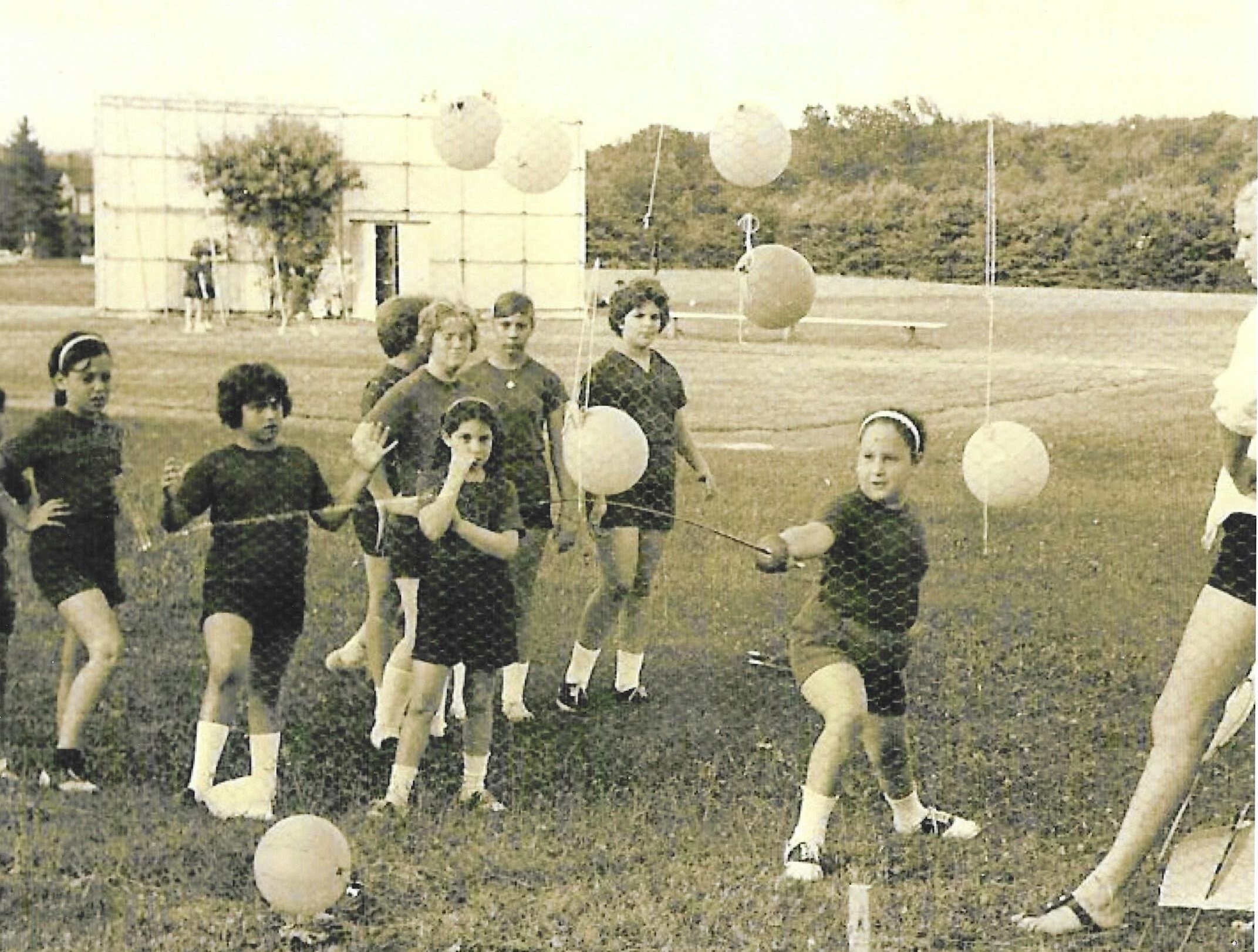 1950s—fencing on the girls’ athletics fields. Green (not white) t-shirts for the uniform and the campers are wearing saddle shoes.