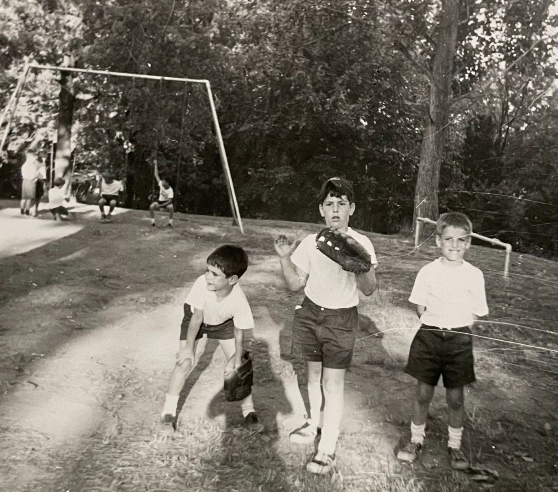  Vintage 1966—from Ricky Shorin: Hanging out on the lower hill with Richie Berger, Jim Shorin, and Jeff Friedman. Maybe the last summer for the swing set behind bunk 1-2? 