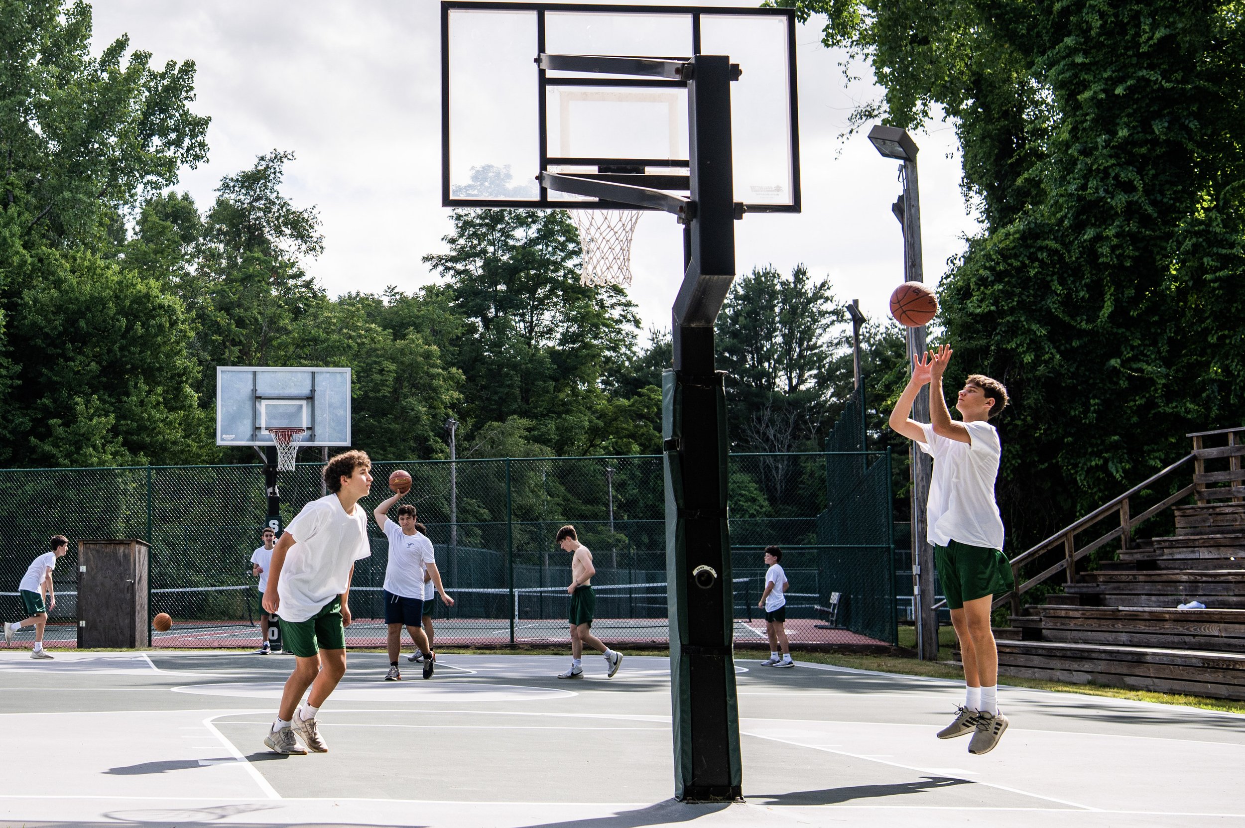  Now—Fiberglass backboards. Trees and shade.  