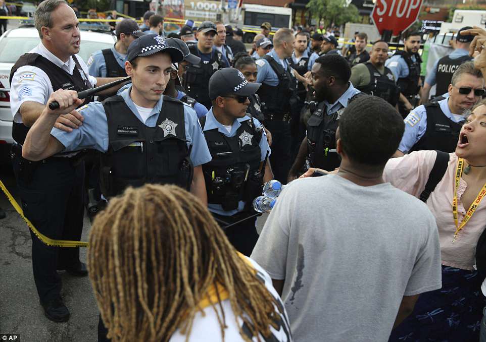 Protesters Gather in Chicago After Police Fatally Shoot Local Barber