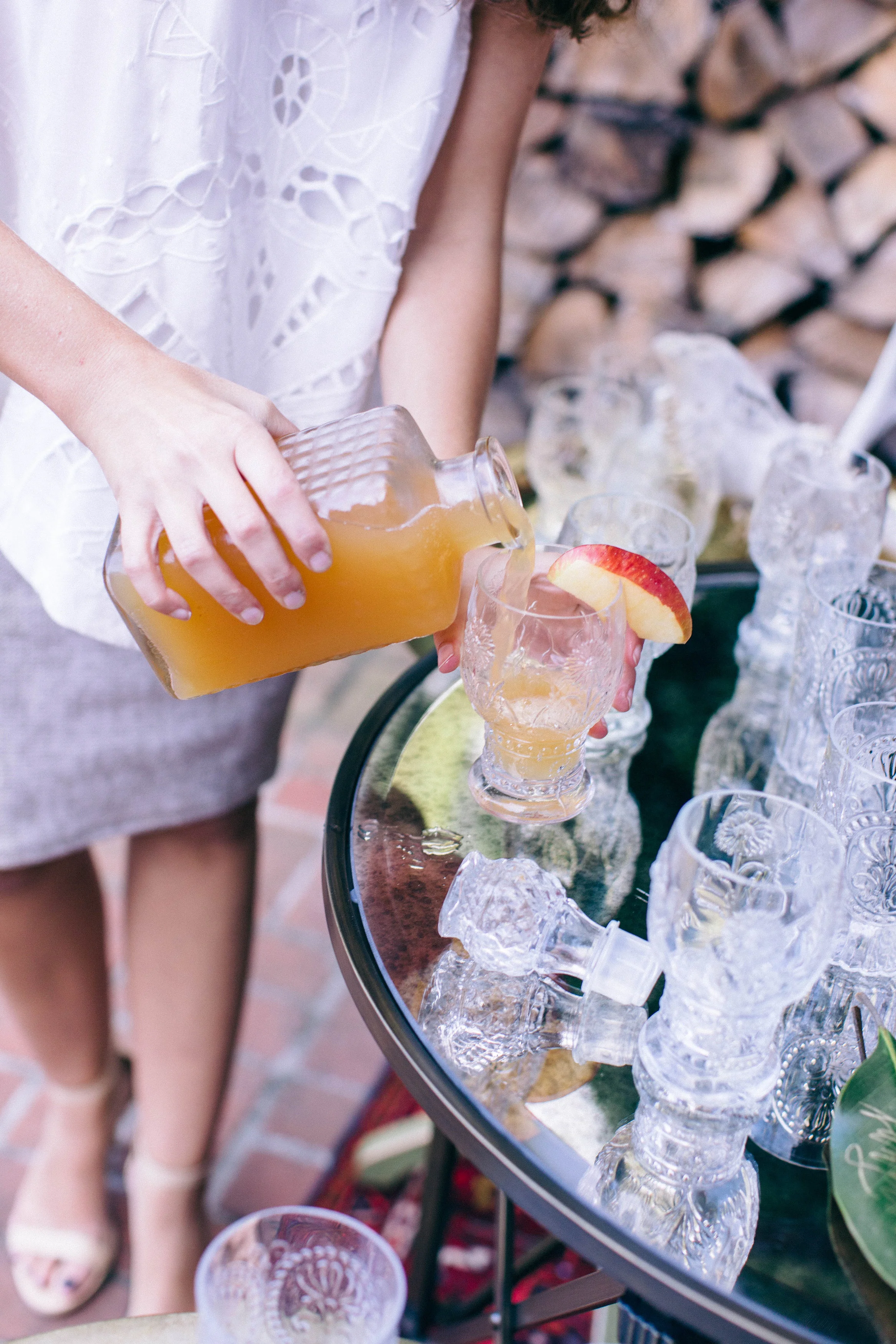 Caroline pouring drinks for guests.