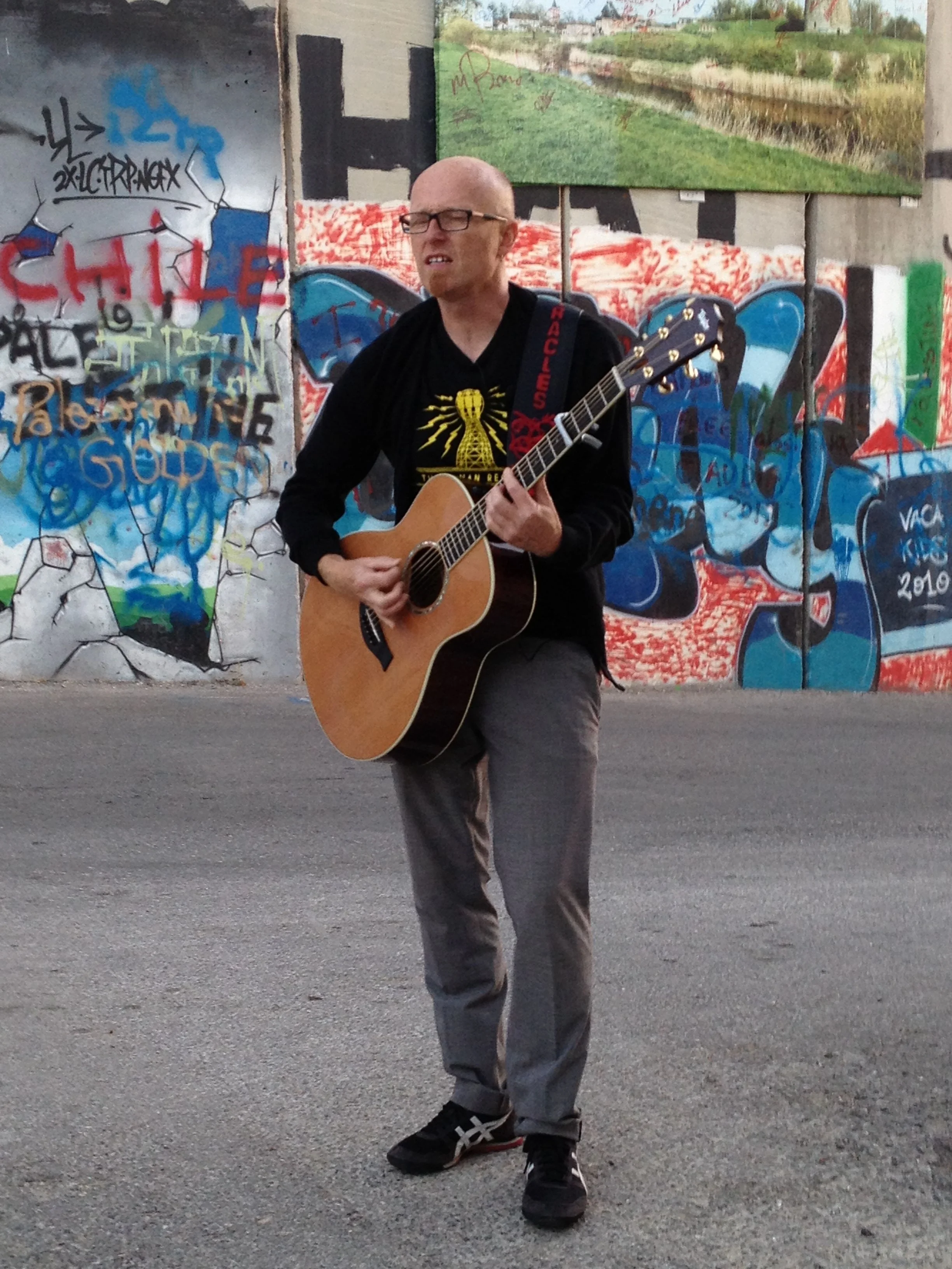 singing by the separation wall Bethlehem Palestine