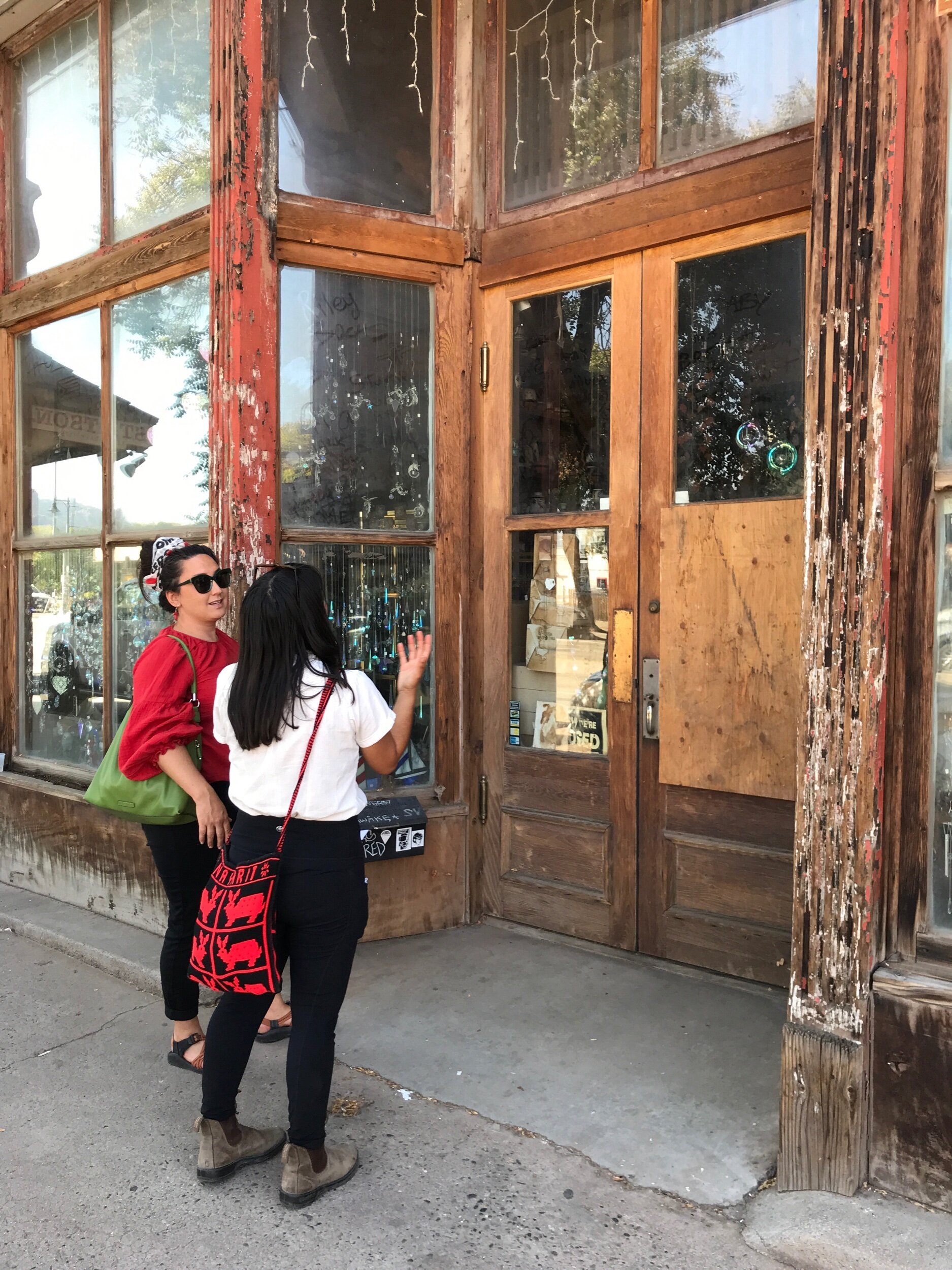 Serah & Blanca contemplating a crystal shop in Moab, UT