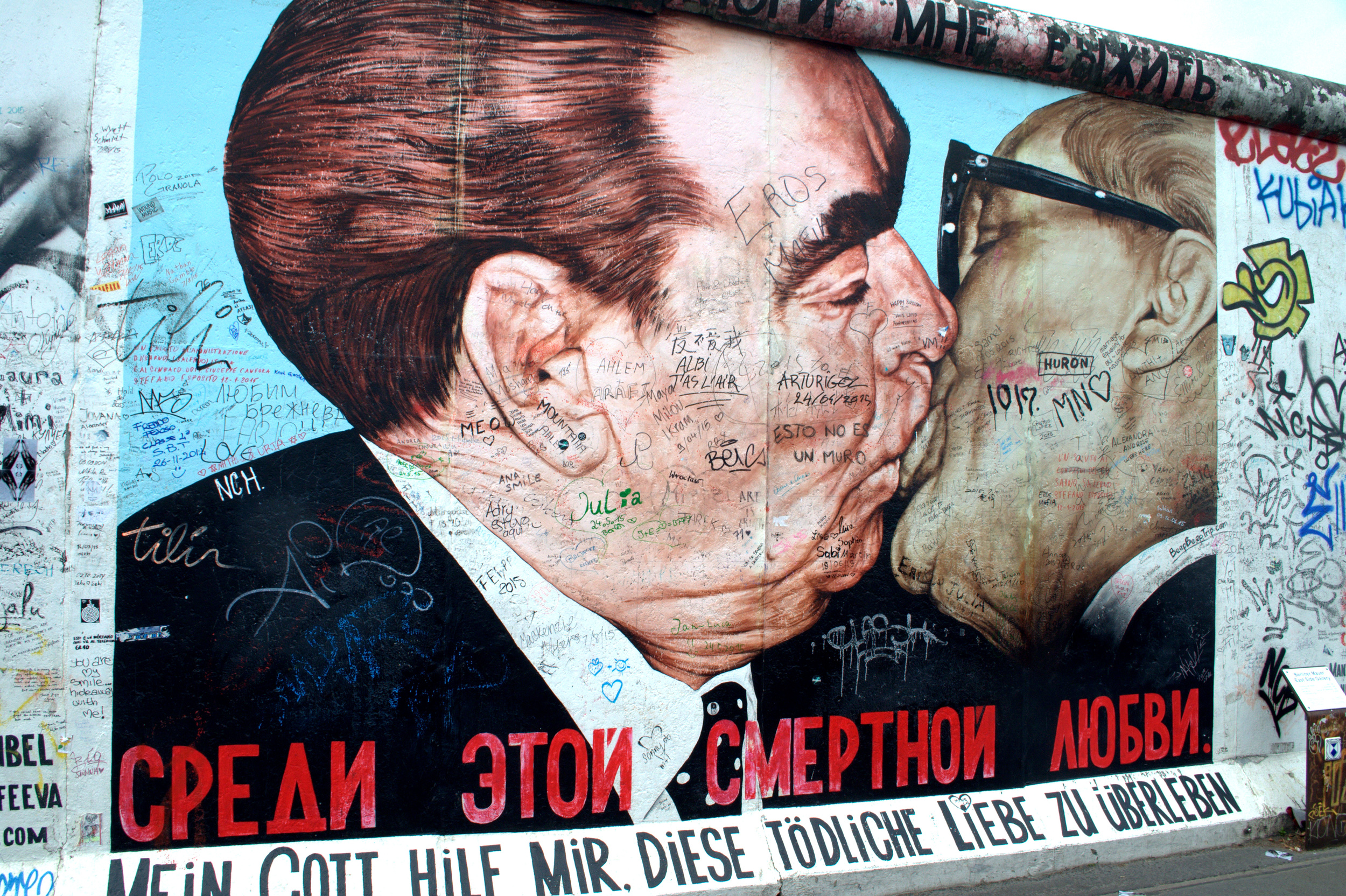 The fraternal kiss between Enrich Honecker and Leonid Brezhnev is now a graffiti painting on the East Gallery of the Berlin Wall named "My God, Help Me to Survive This Deadly Love".