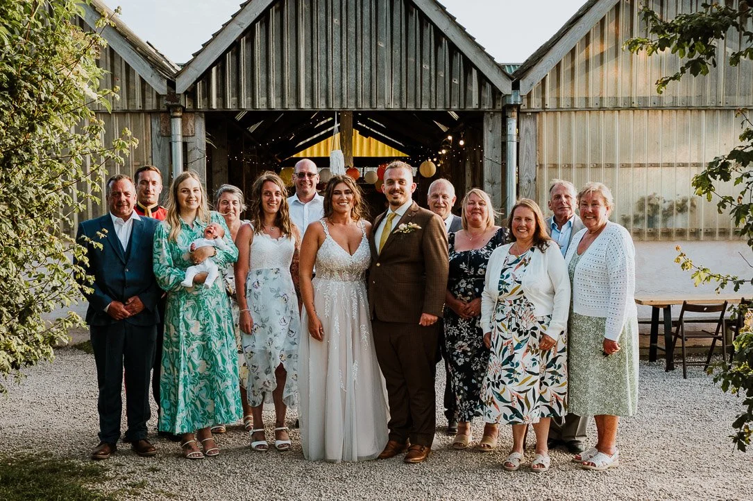 Wedding Family Group Photo in front of Porthtowan Ecopark Wedding Venue