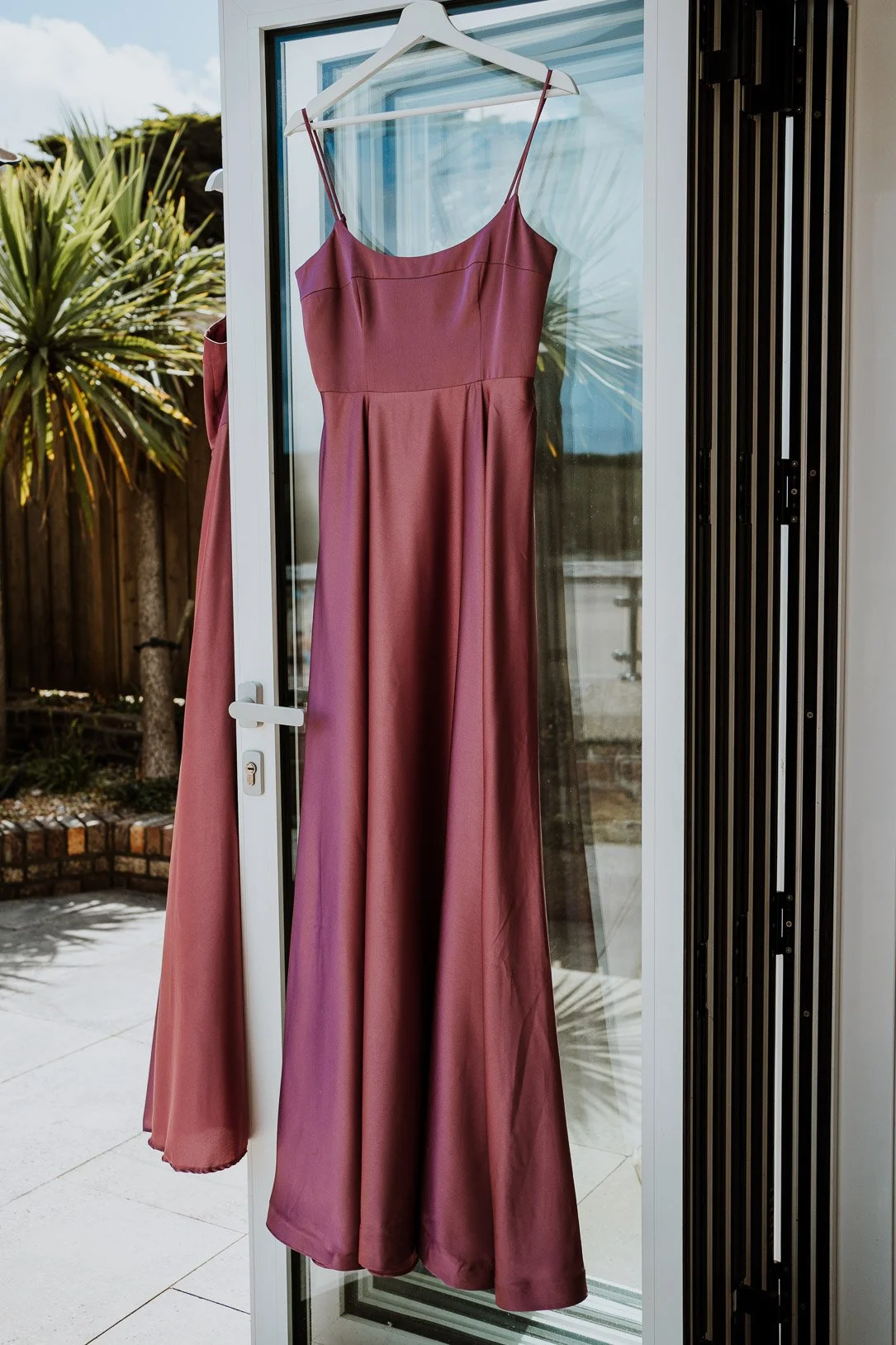 Bridesmaid's dresses hanging up. Bridal Preparation Photos