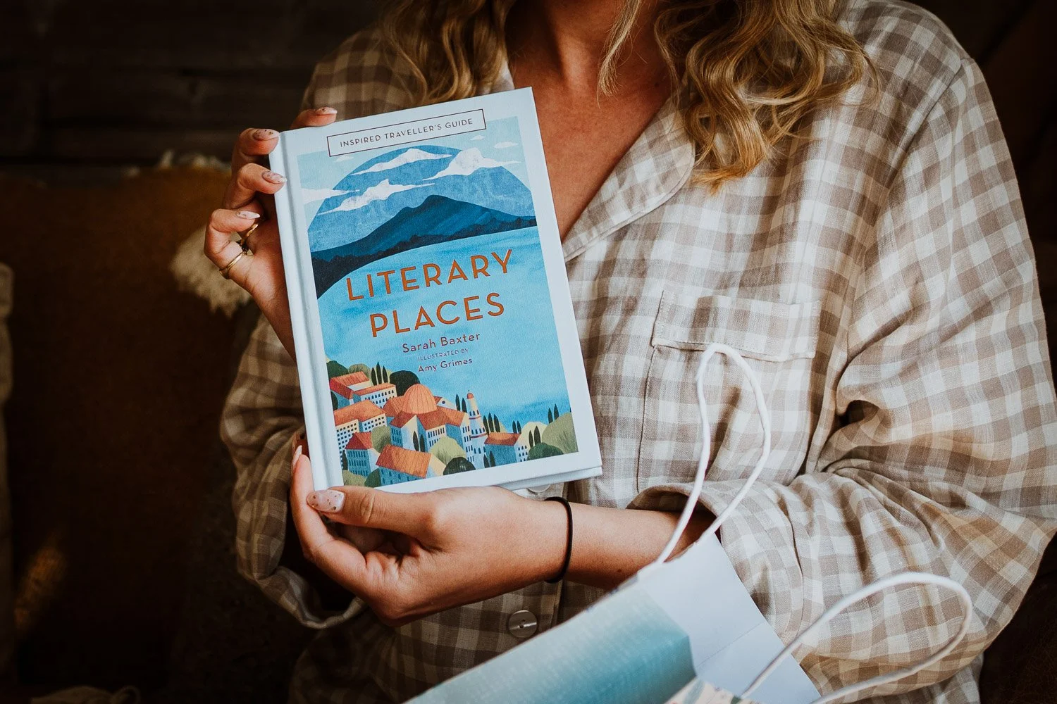 The bride showing me a present from her fiancé, a book she had on her wish list 'Literary Places'