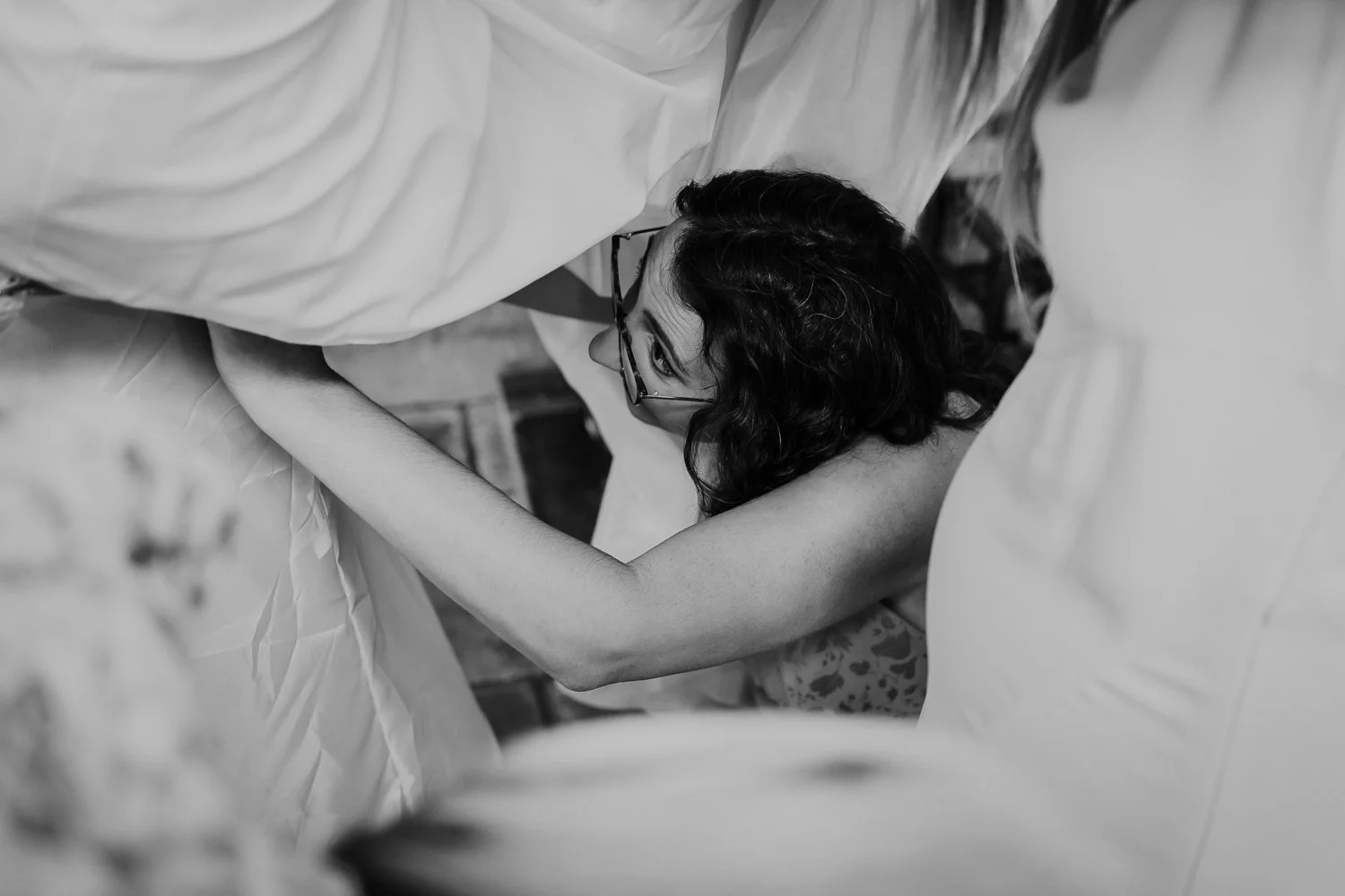 Bridesmaid making last minute adjustments to the wedding dress. Bridal Preparation Photo