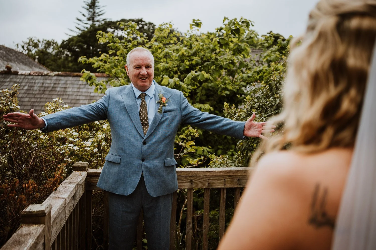 Father of the bride seeing his daughter in her wedding dress the first time. Emotions captured. First Look Photos Father of the bride and daughter