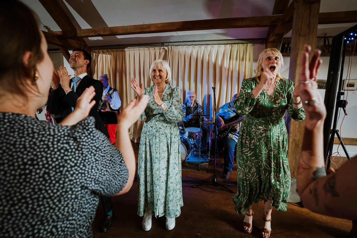 People dancing and enjoying live music at a wedding reception party. Ceilidh dance photo