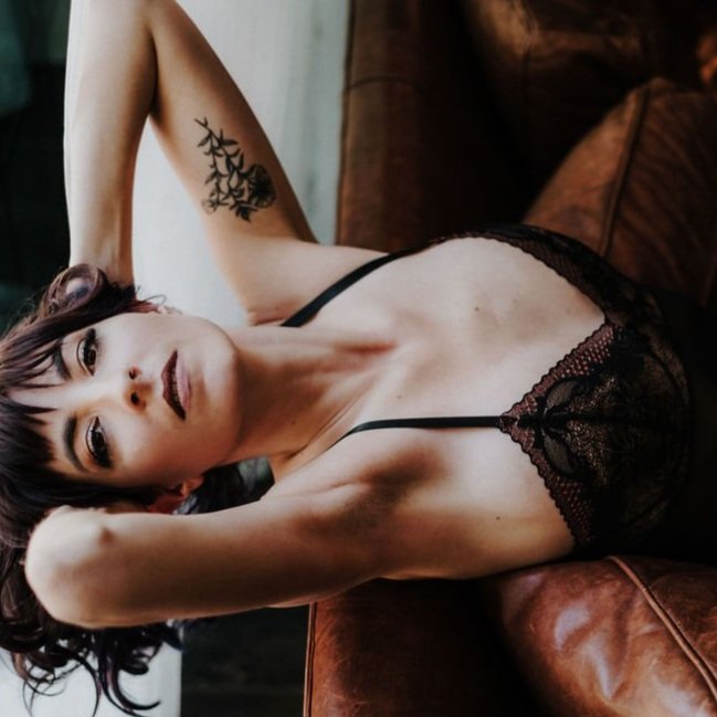 A close-up image highlighting the delicate lace pattern on the bodysuit.