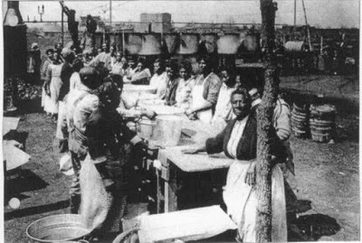 African women and men at a community Brunswick stew event, Courtesy of the Library of Congress