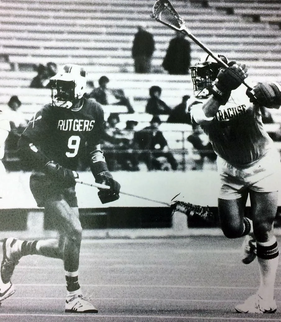 Greg Tarbell, right, taking a shot against Rutgers University in the carrier Dome. Courtesy of Syracuse University.
