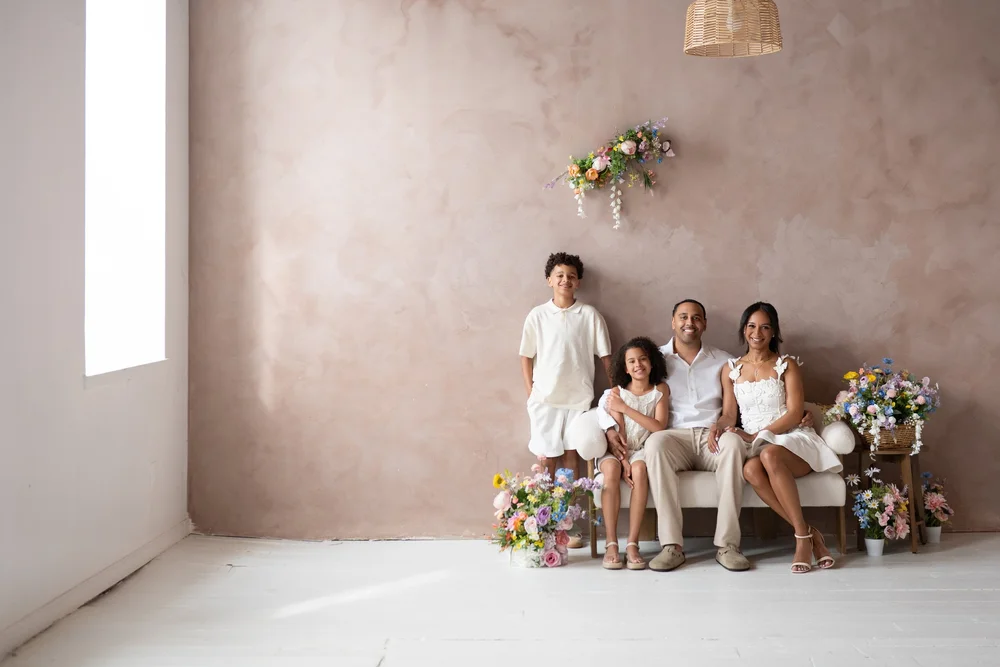 Family portrait in studio with floral set design