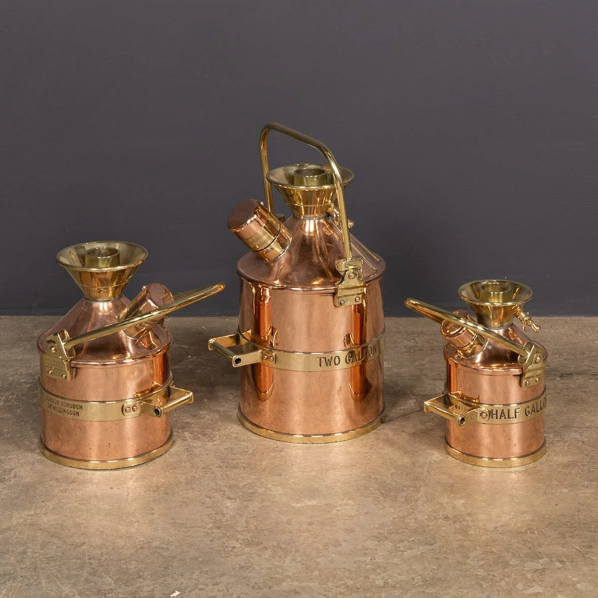 PUSHKINS.COM - Z12111 - VINTAGE 20thC ENGLISH SET OF THREE POLISHED CHECKPUMP PETROL CANISTERS c.1965 - 03.jpg