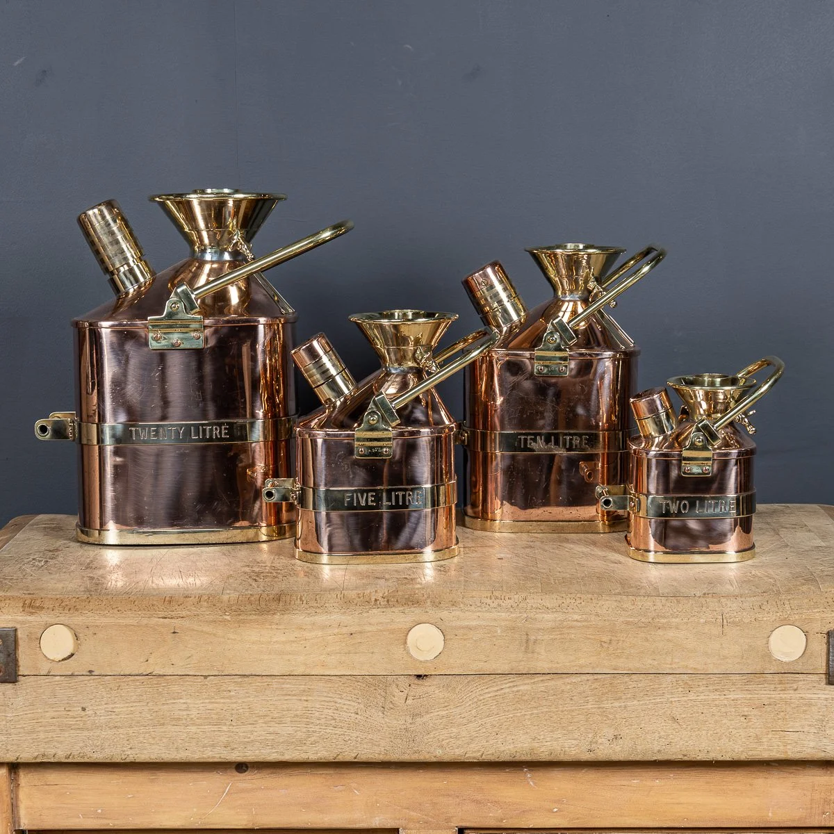 PUSHKINS.COM - D11129 - MID 20thC SET OF FOUR POLISHED COPPER & BRASS PETROL CANS, WRAGG BROS LTD c.1965 - 05.jpg