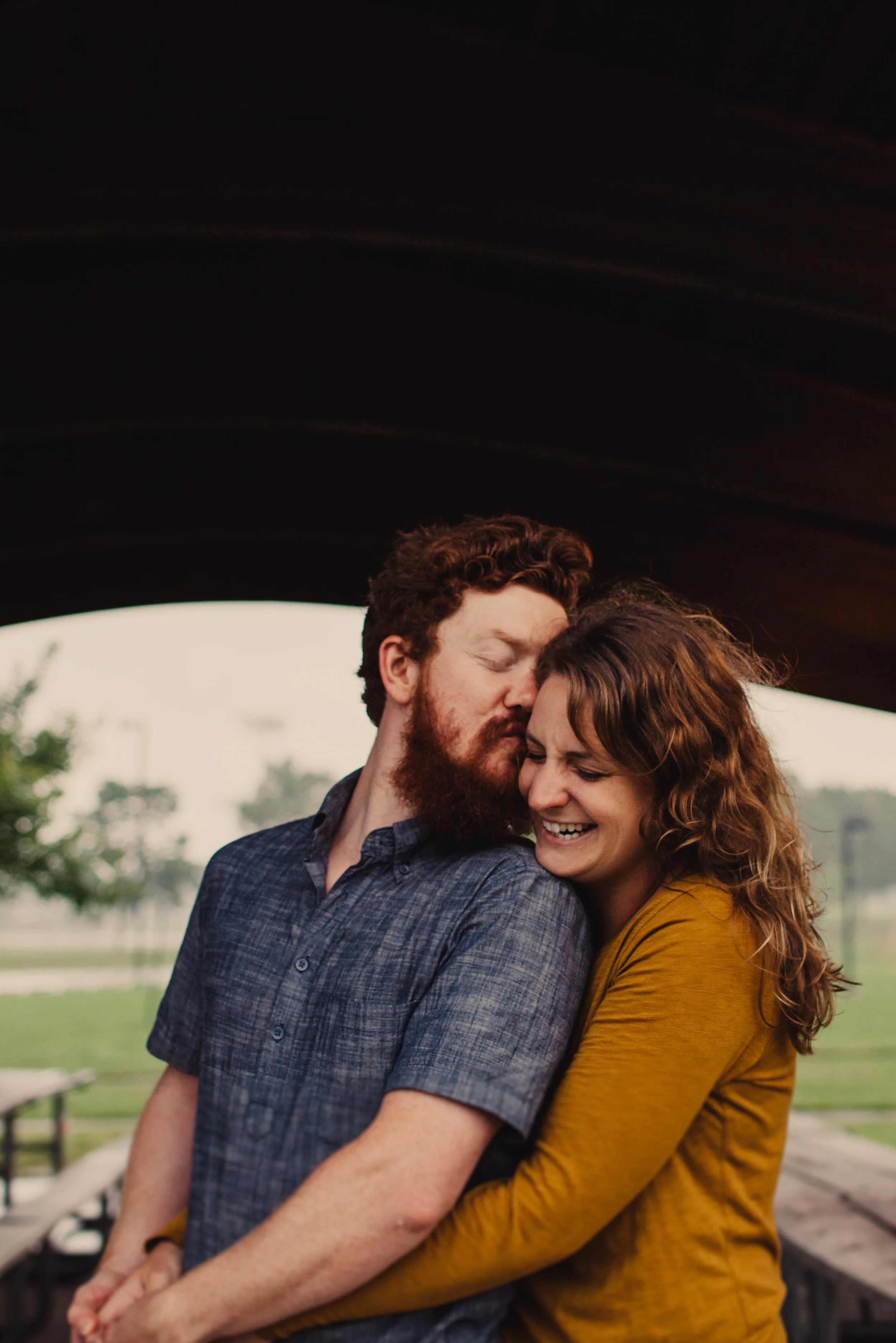 Engagement portrait of Maryland couple outside at a park.