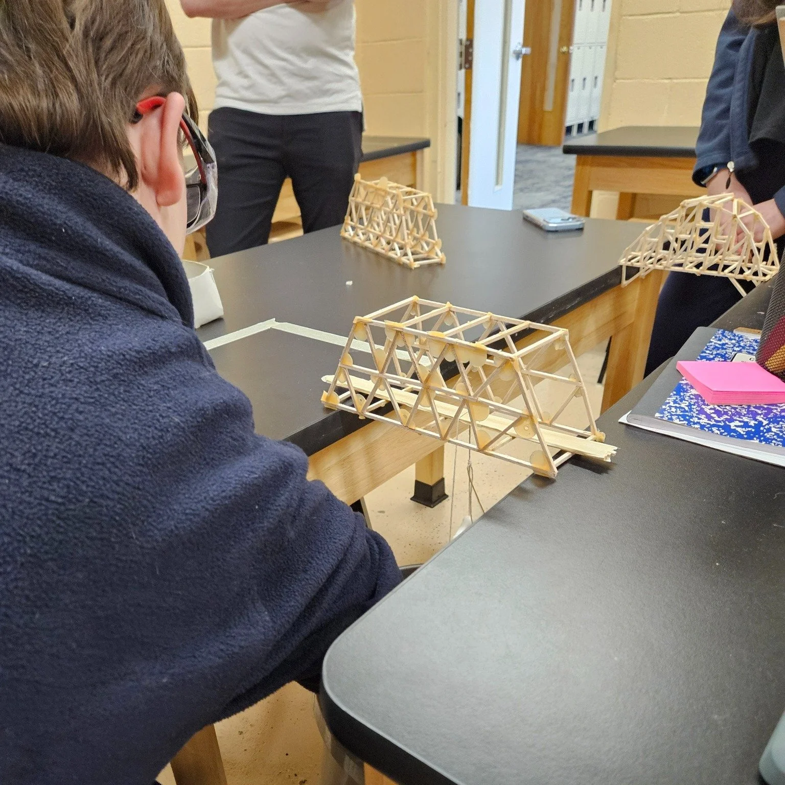 🏗️ Our Physics students spent the past several months designing and building bridges while working within real engineering design specifications &mdash; including length, height, width, and depth!
The exciting final challenge? Testing how much weigh