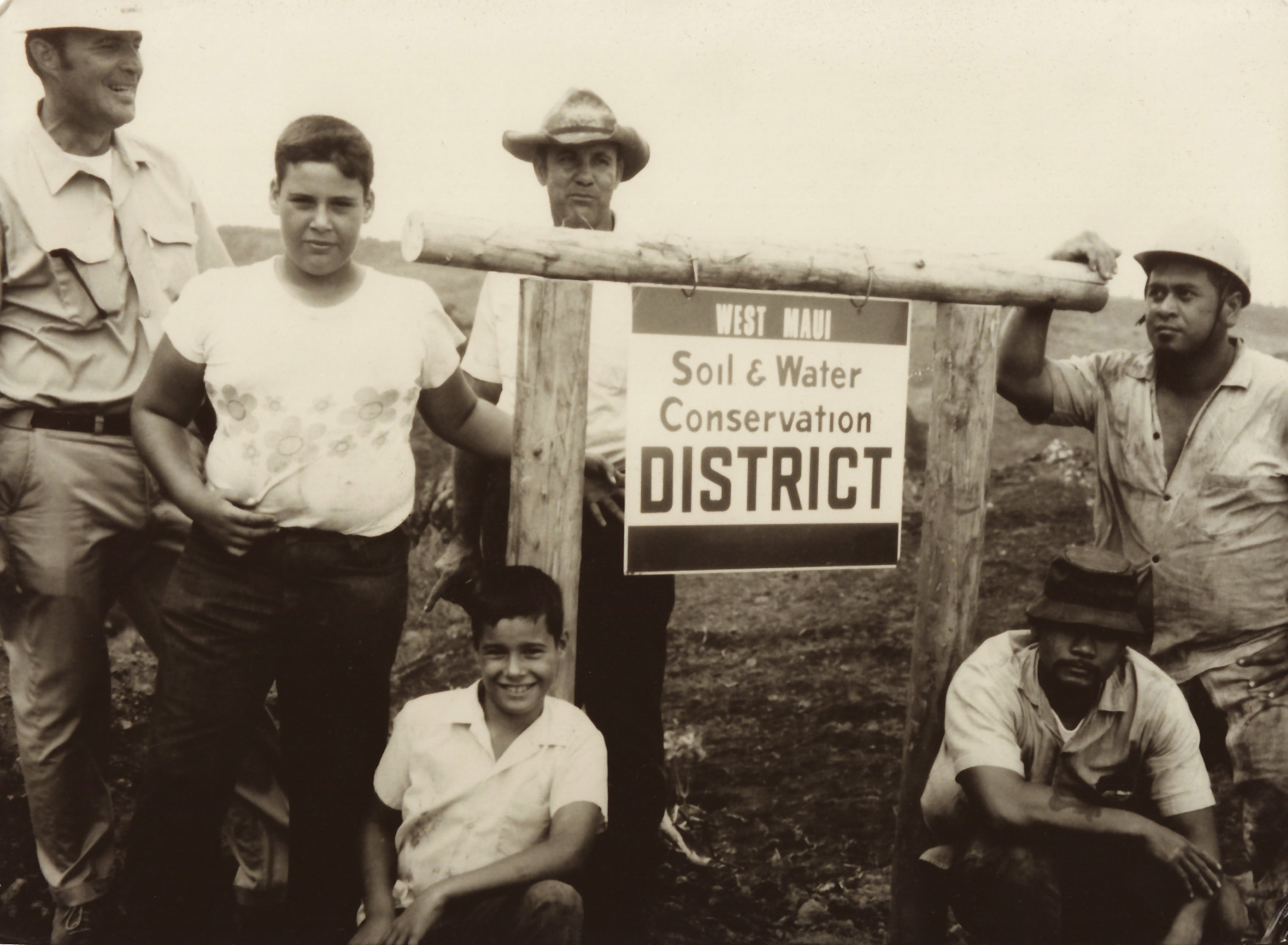 A West Maui SWCD crew completes work on a scenic lookout at Papanalohoa. Pictured from left: G. Paresa, D. Nobriga, D. (Buddy) Nobriga, James Nobriga (kneeling) and two Olinda Honor Camp workers.