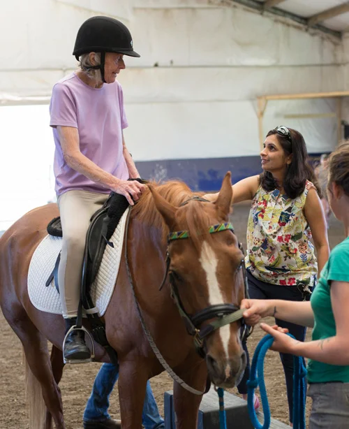 Naseem Chatiwala, PT, MS, DPT, NCS, (standing to right of the horse) is a clinical specialist in neurology and pediatrics at Emerson’s Center for Rehabilitative and Sports Therapies. She helps patients overcome the challenges that result from strokes, vertigo, concussions and balance issues. 