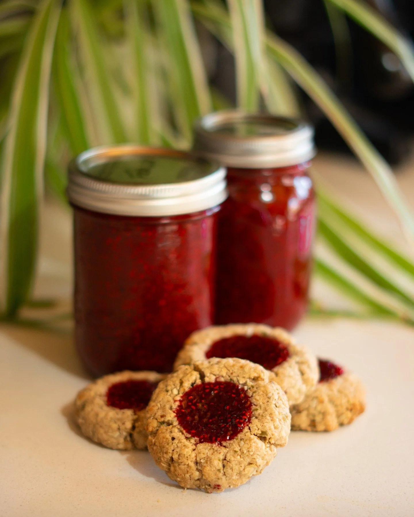 Our raspberry jam is homemade, slowly cooked to bring out that rich, fruity flavour and beautiful natural sweetness. We spoon this goodness into the centre of our jam cookies, creating that perfect combination of soft and vibrant raspberry filling.

