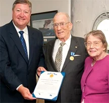 Secretary of the Air Force Michael Donley (left) presented Chester Burger (center) and his wife Elisabeth (right) the Air Force Distinguished Public Service Award Aug. 24, 2010, for his service as an Air Force advocate under the Public Affairs Advisory Group in New York City for more than 15 years. (U.S. Air Force photo/Lance Cheung)