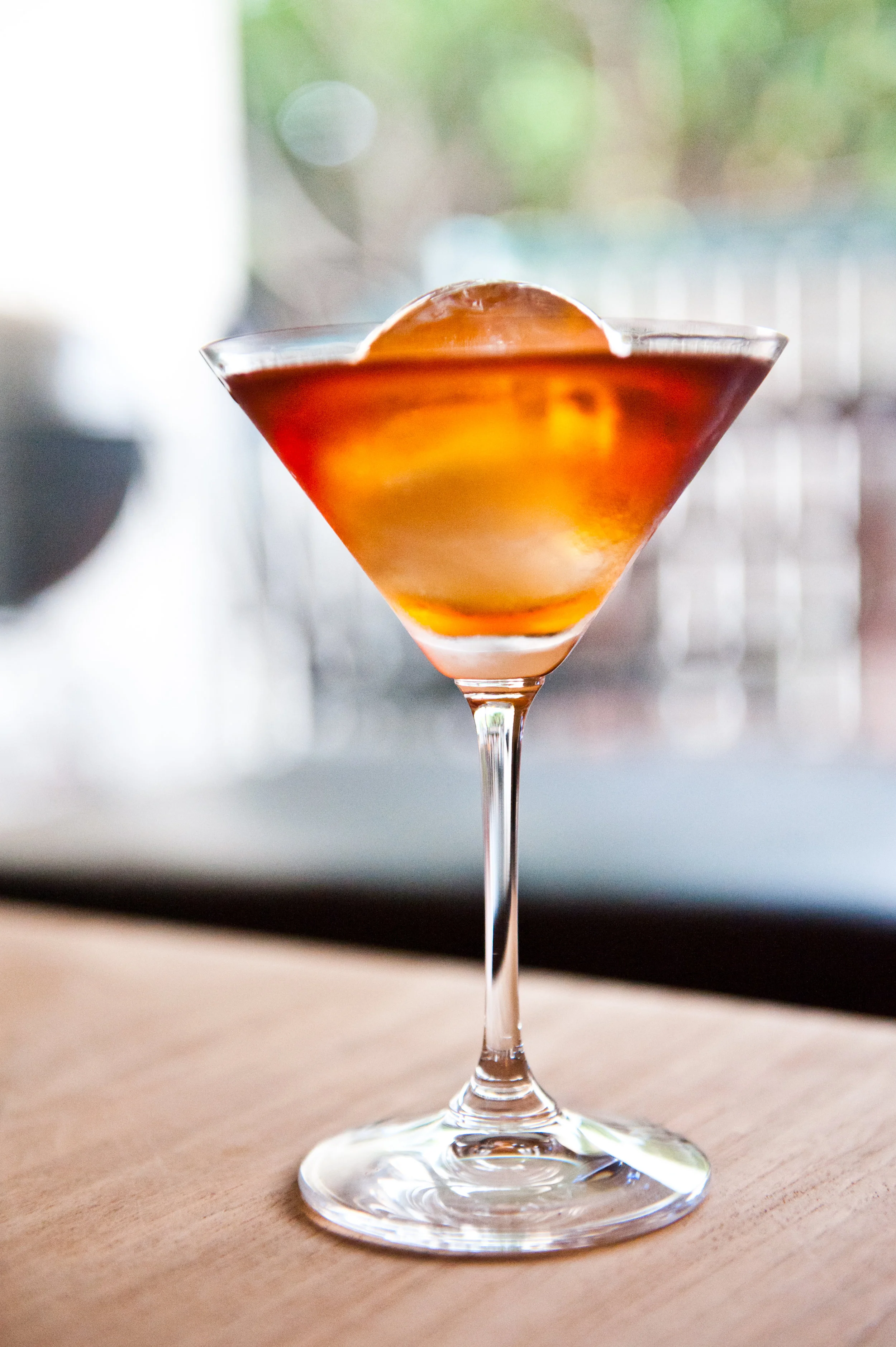 The Manhattan - This classic drink impresses and signifies an old soul, fanciness, and a good knowledge of cocktails. It contains Dash Angostura bitters, Canadian whiskey, sweet red vermouth, and a maraschino cherry.