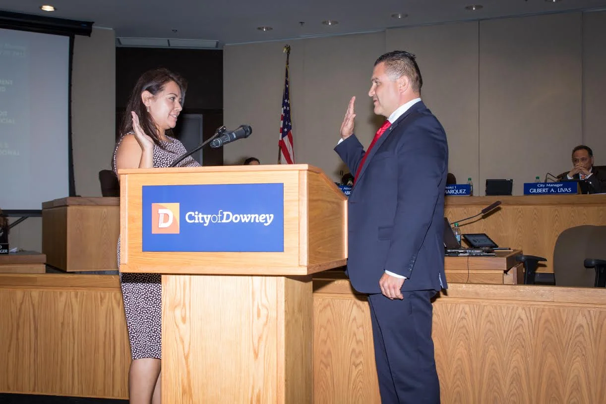 Mayor Luis Marquez is sworn-in to the San Gabriel and Lower Los Angeles Rivers and Mountains Conservancy by city clerk Adria Jimenez.