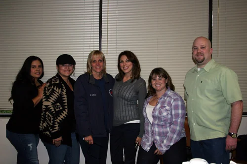 Photo courtesy Downey Police Department Communications supervisor Heidi Calhoun, third from left, and other police dispatchers. Calhoun retired recently after 31 years with the department.