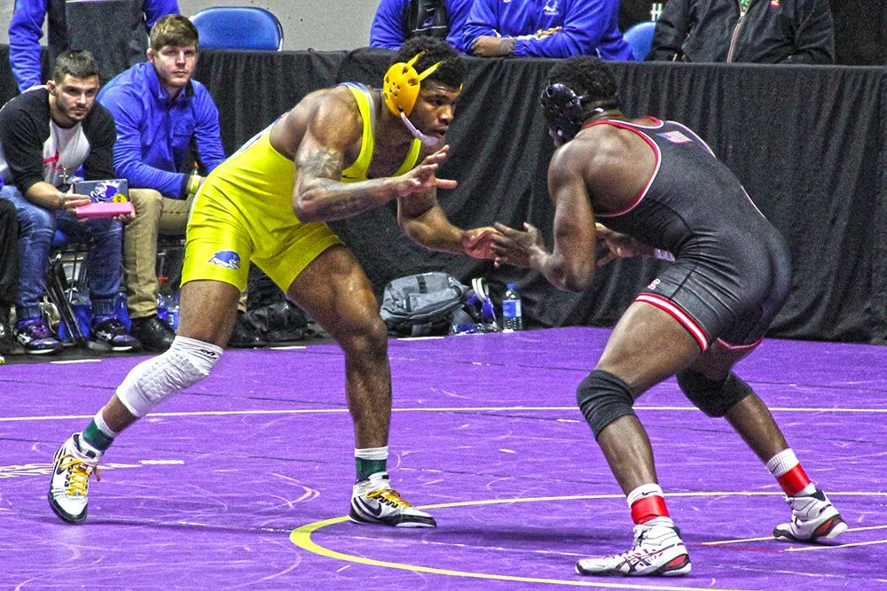 Santa Fe grad wins fourth consecutive wrestling title 